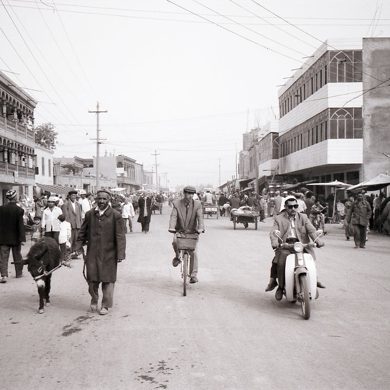 Photo of people in a street of Kashgar during the Sunday market